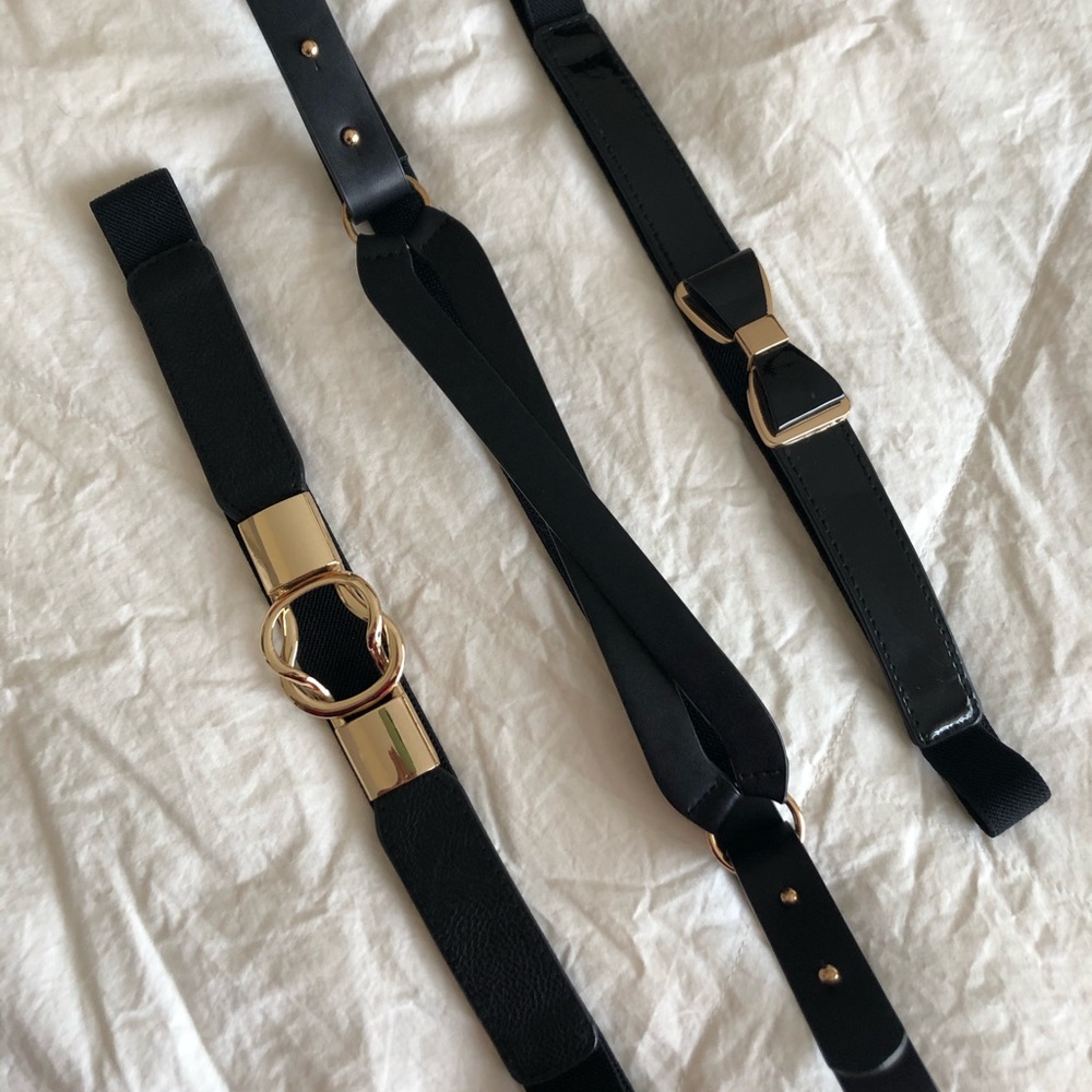 Pack of 3 black stretchy belts.